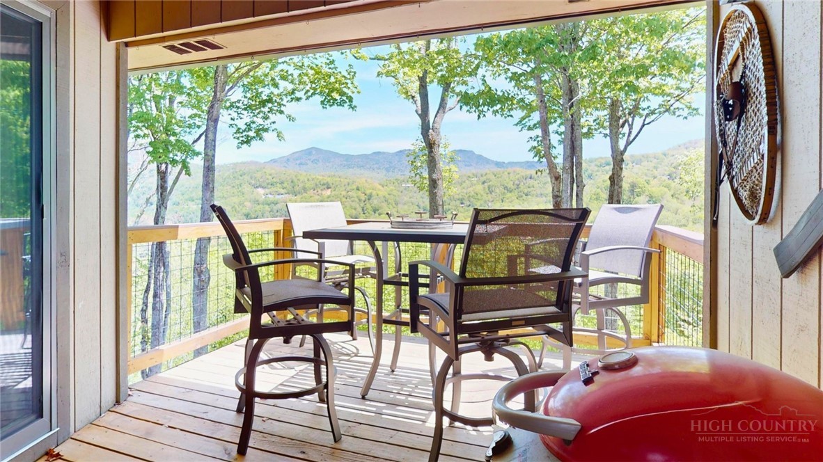 250 Ridgeview Road, Unit 43 Sugar Mountain, NC 28604 - Photo 20 of 21 a view of a chairs and table in balcony
