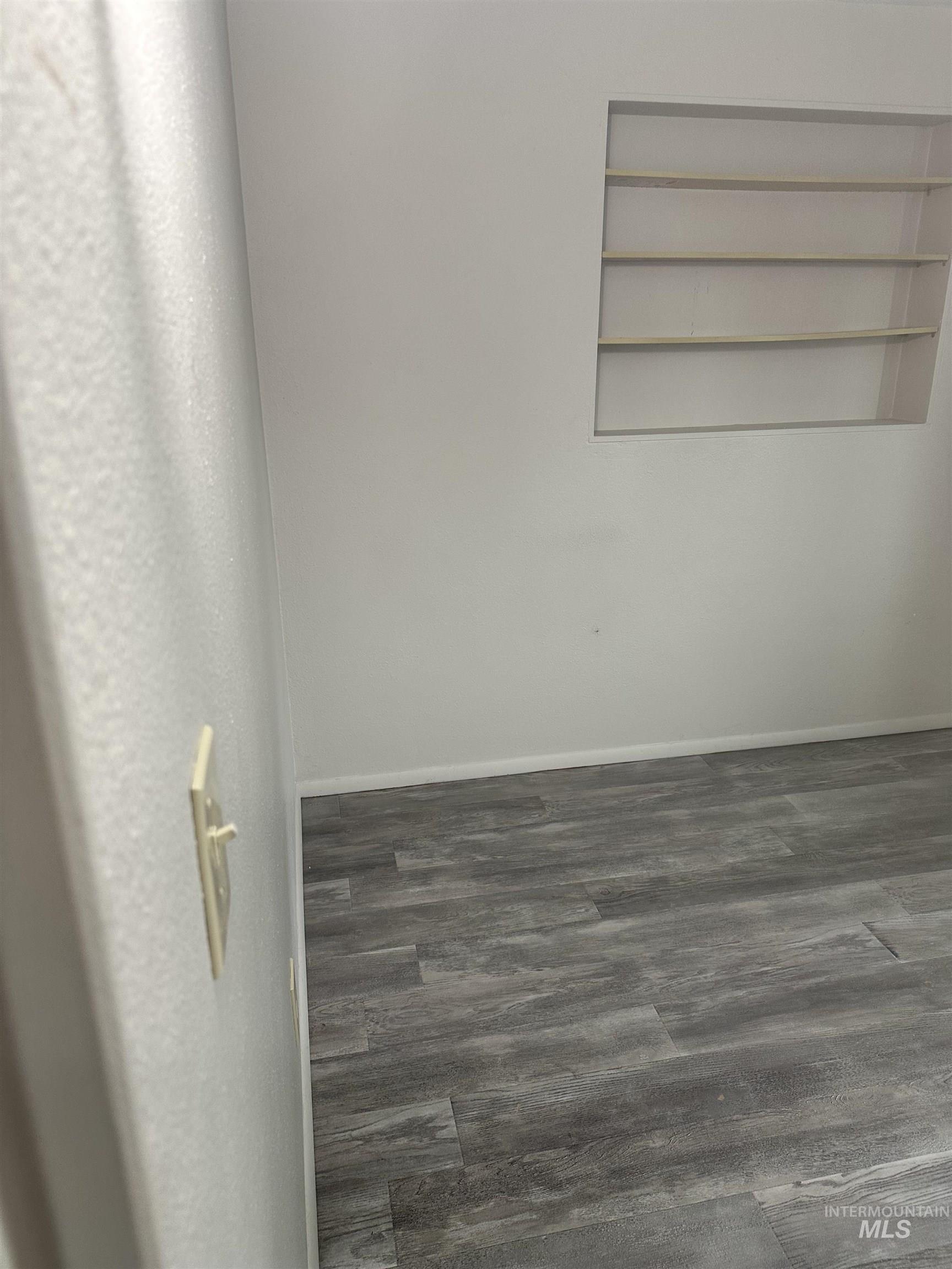 661 Southwest 3rd Street Ontario, OR 97914 - Photo 15 of 45 Unfurnished room with dark wood-style floors and baseboards
