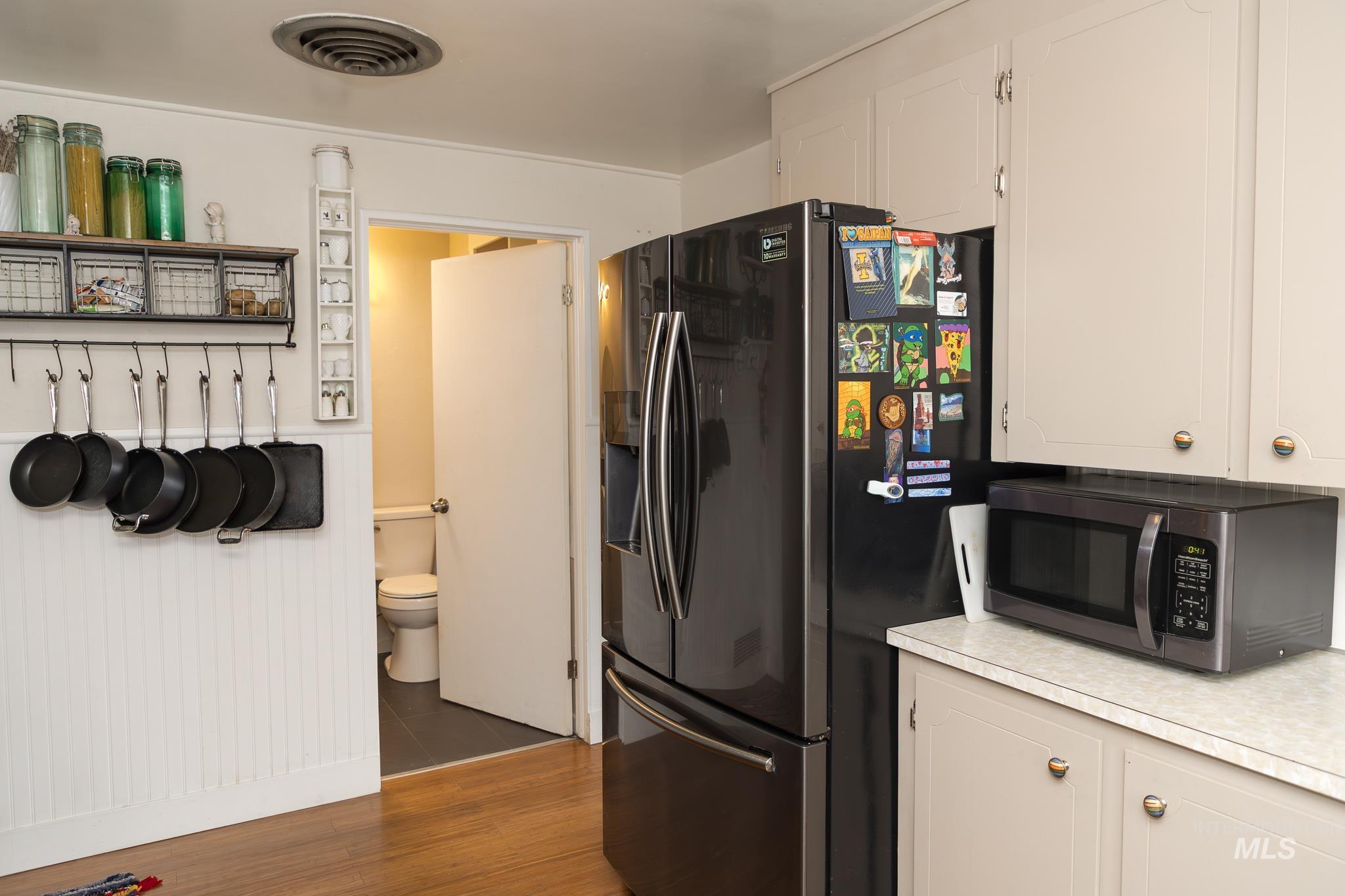 661 Southwest 3rd Street Ontario, OR 97914 - Photo 18 of 45 Kitchen with stainless steel appliances, white cabinetry, and light countertops