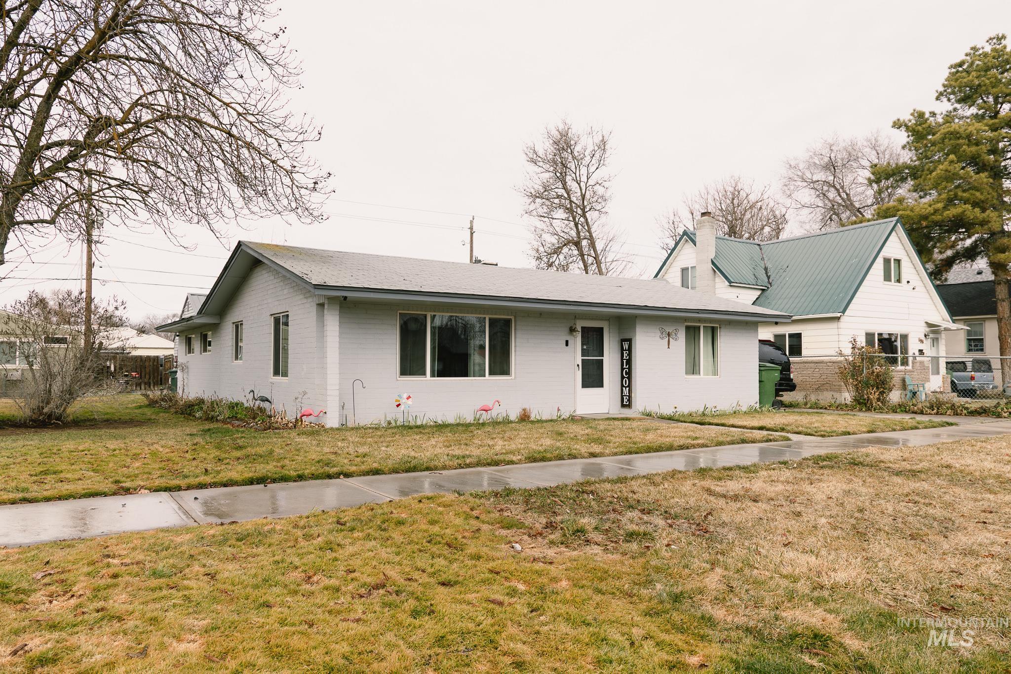 661 Southwest 3rd Street Ontario, OR 97914 - Photo 2 of 45 View of front of home with a chimney and a front yard