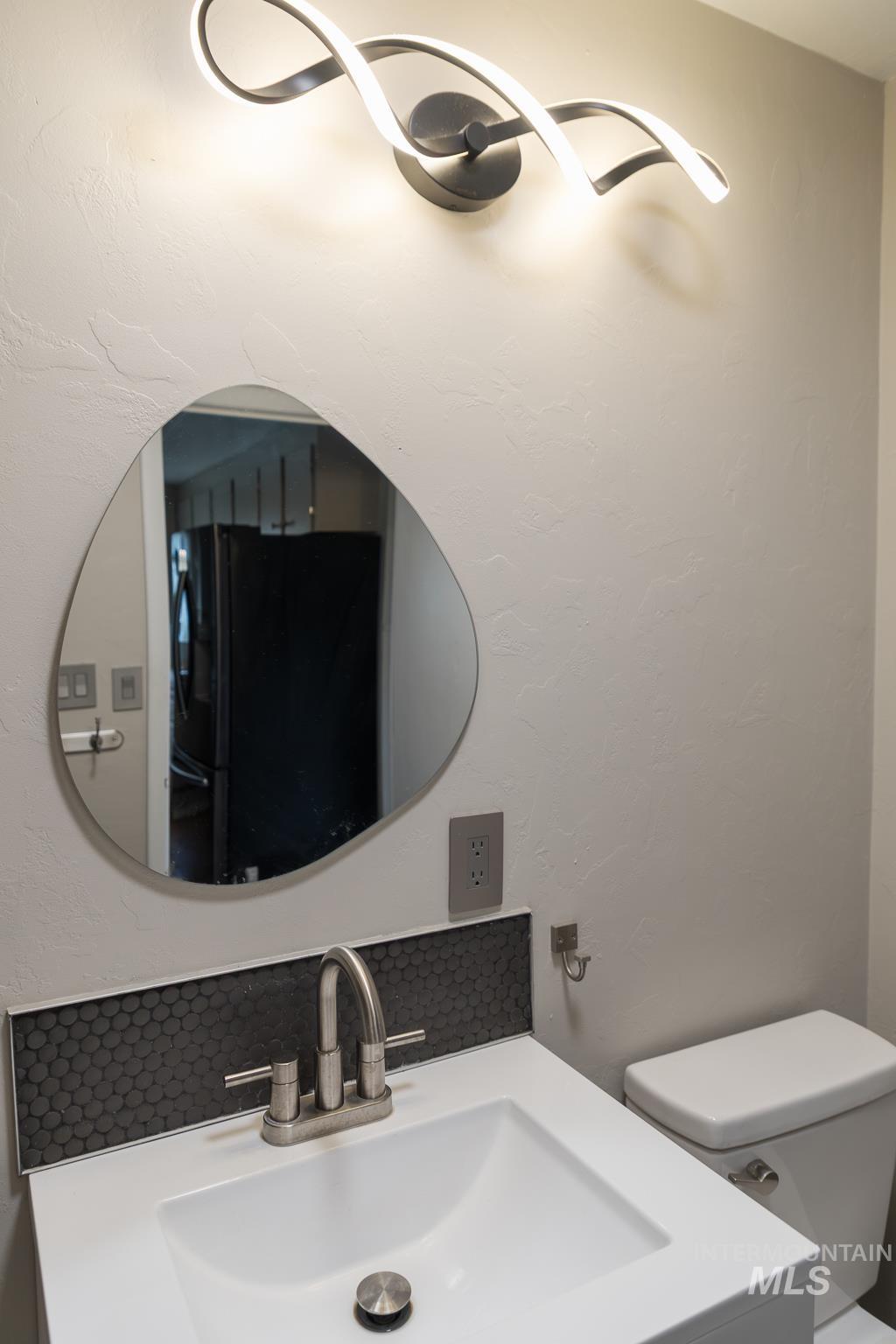 661 Southwest 3rd Street Ontario, OR 97914 - Photo 23 of 45 Bathroom with vanity and a textured wall