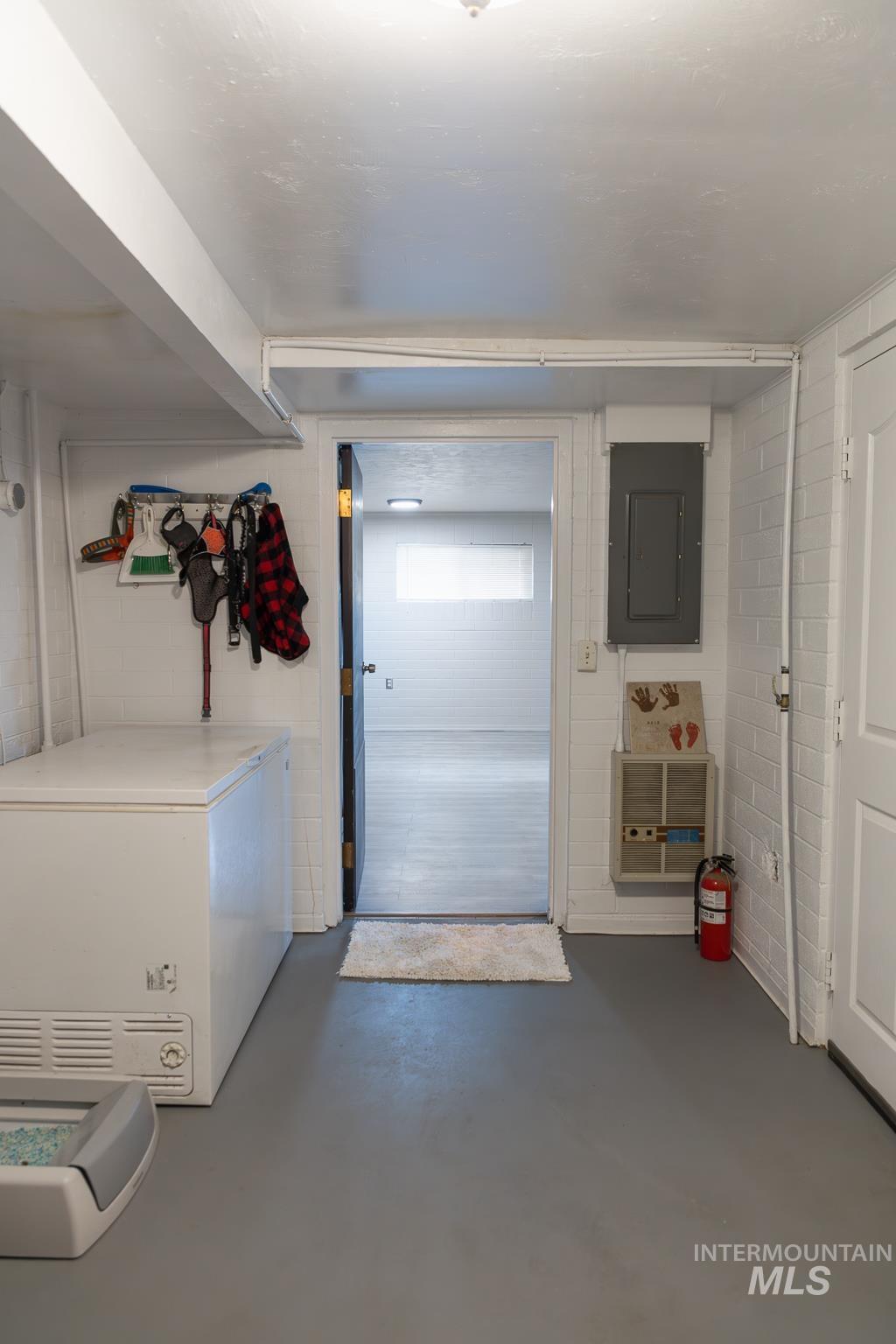 661 Southwest 3rd Street Ontario, OR 97914 - Photo 31 of 45 Laundry area featuring concrete floors, electric panel, and concrete block wall