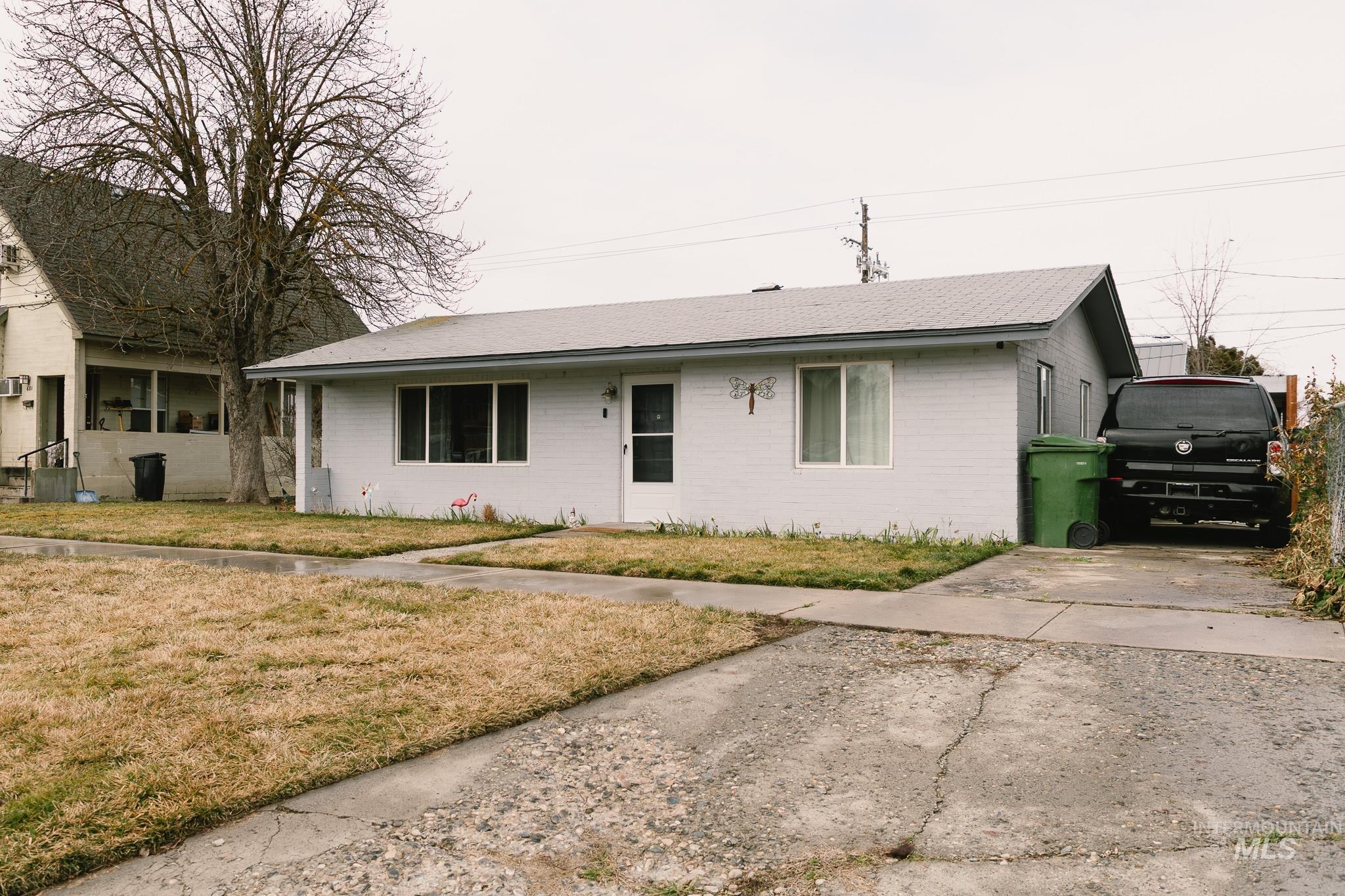 661 Southwest 3rd Street Ontario, OR 97914 - Photo 44 of 45 Ranch-style home featuring a front lawn and brick siding