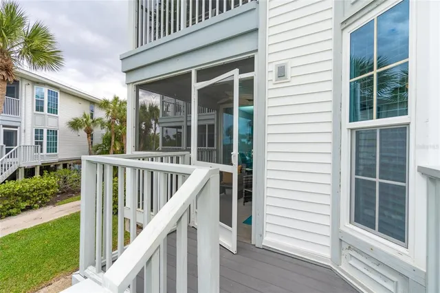a view of staircase with white walls and windows