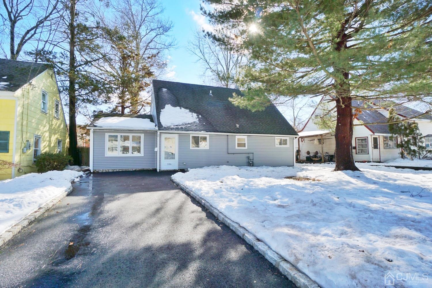 106 Ridge Road Colonia, NJ 07067 - Photo 2 of 44 a front view of a house with a yard and garage
