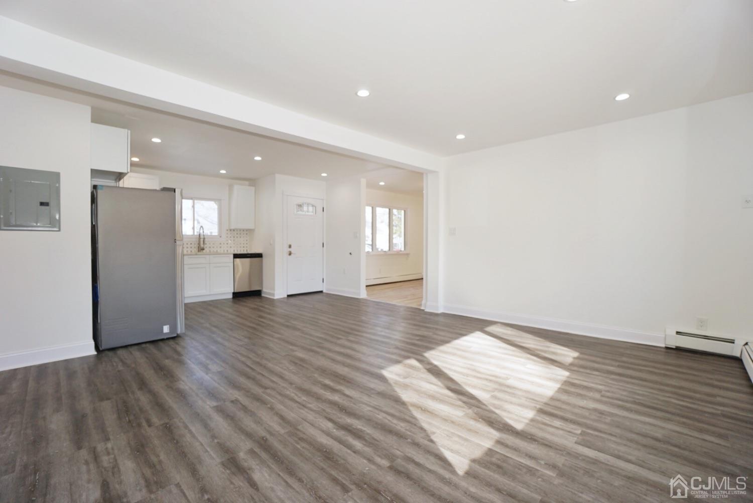 106 Ridge Road Colonia, NJ 07067 - Photo 14 of 44 a view of empty room with wooden floor