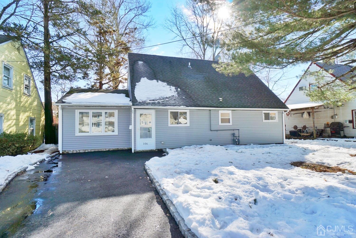 106 Ridge Road Colonia, NJ 07067 - Photo 3 of 44 a view of a house with a snow in the yard