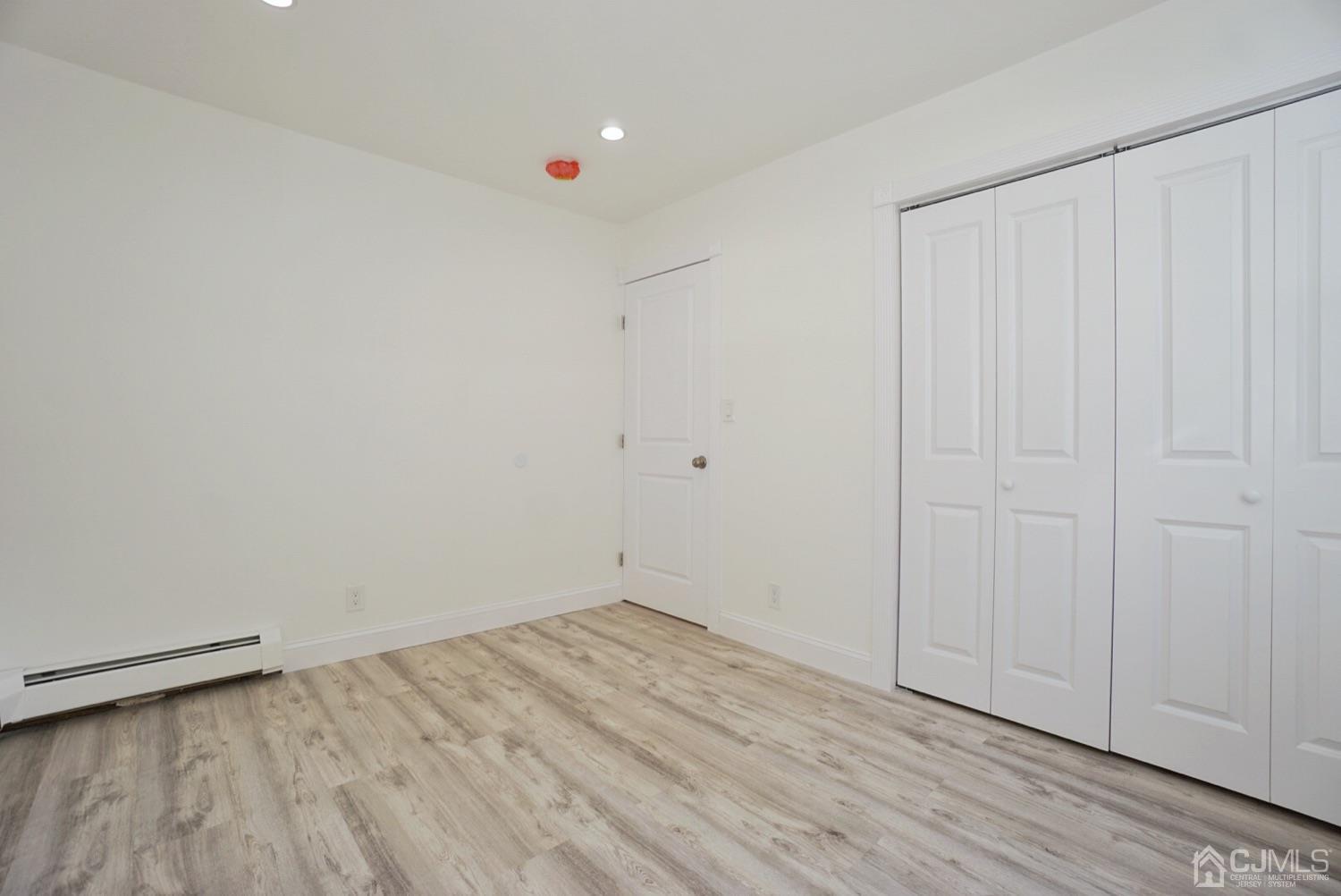 106 Ridge Road Colonia, NJ 07067 - Photo 24 of 44 a view of a room with wooden floor