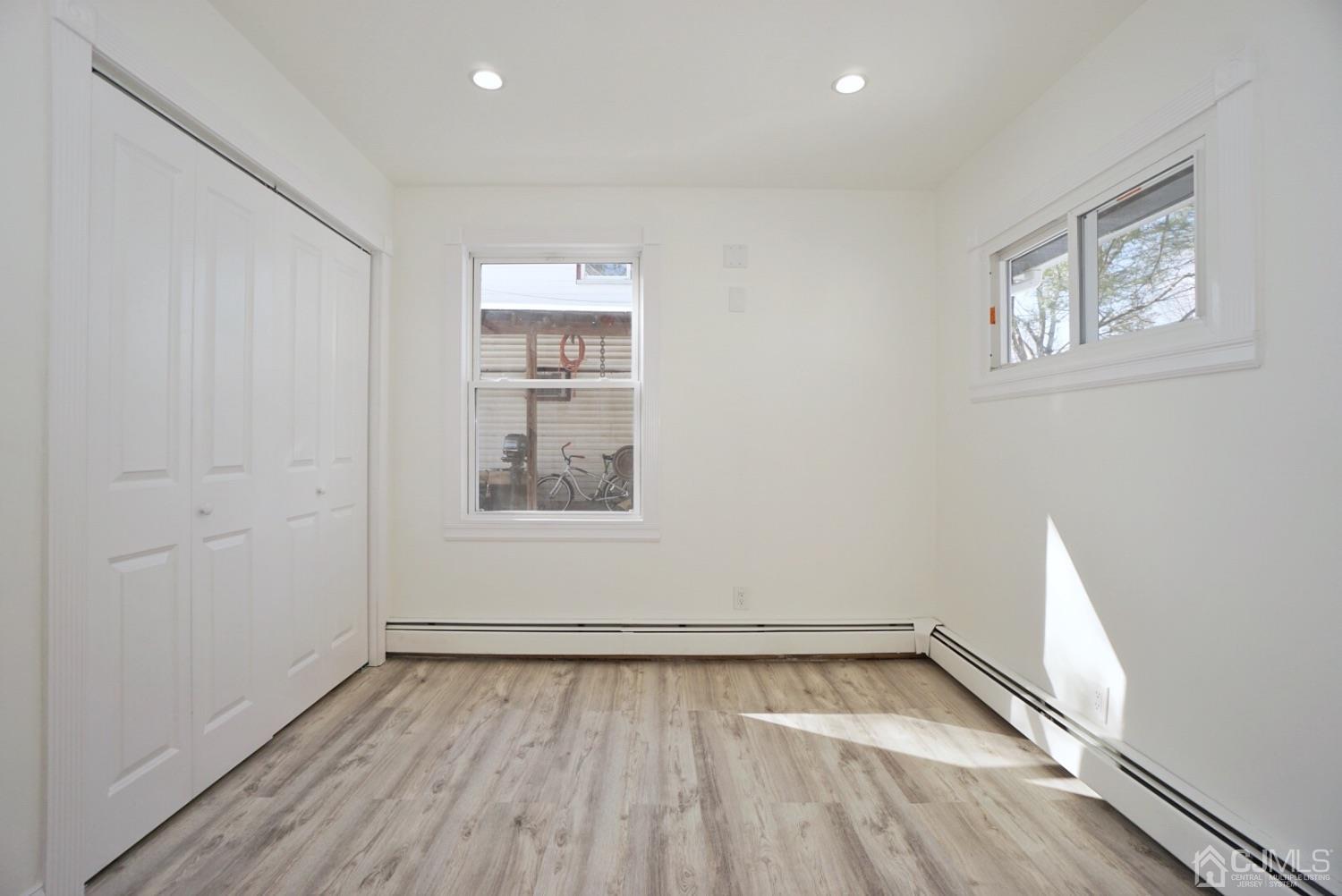 106 Ridge Road Colonia, NJ 07067 - Photo 25 of 44 an empty room with a hardwood and ceiling fan