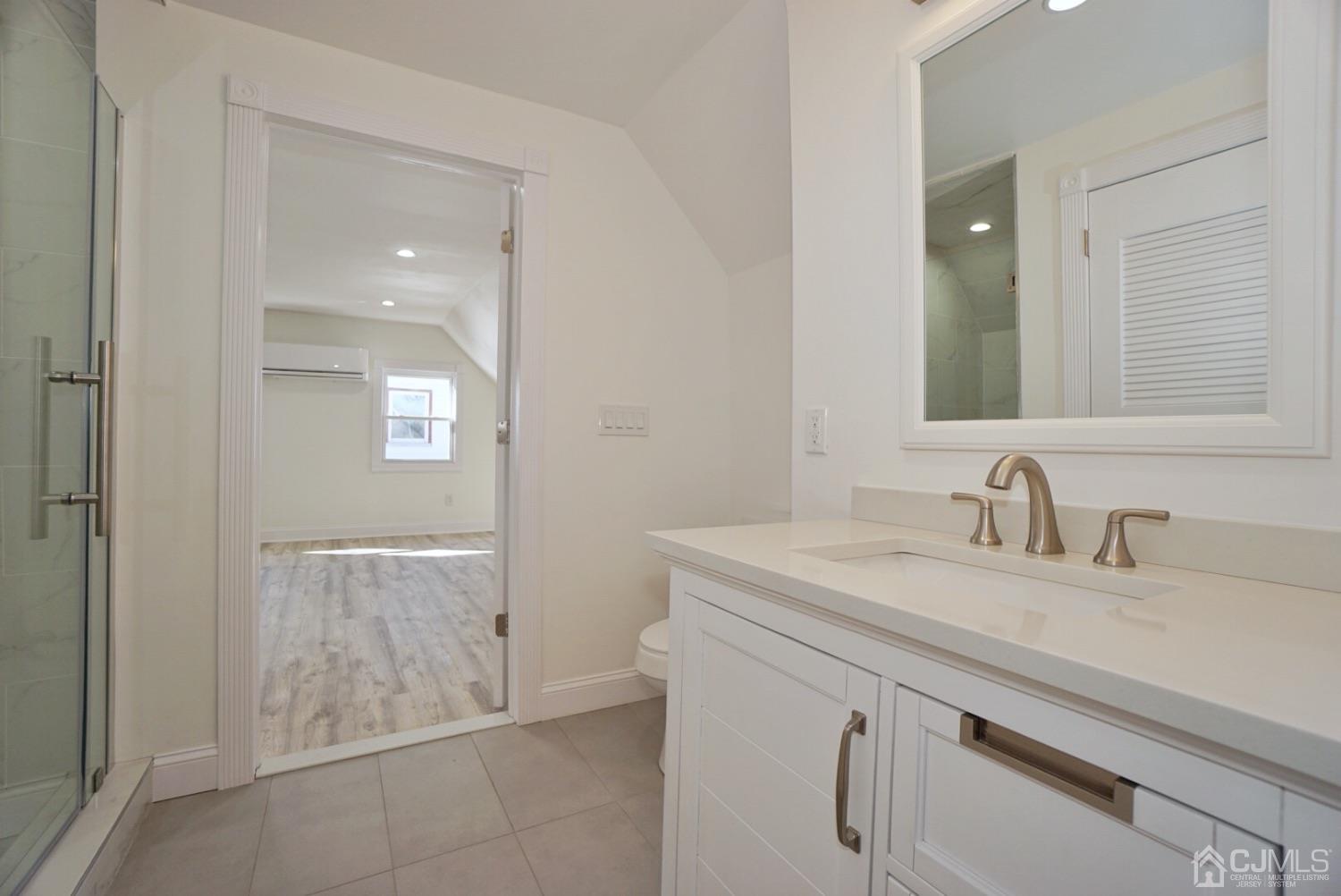 106 Ridge Road Colonia, NJ 07067 - Photo 33 of 44 a bathroom with a sink and a mirror