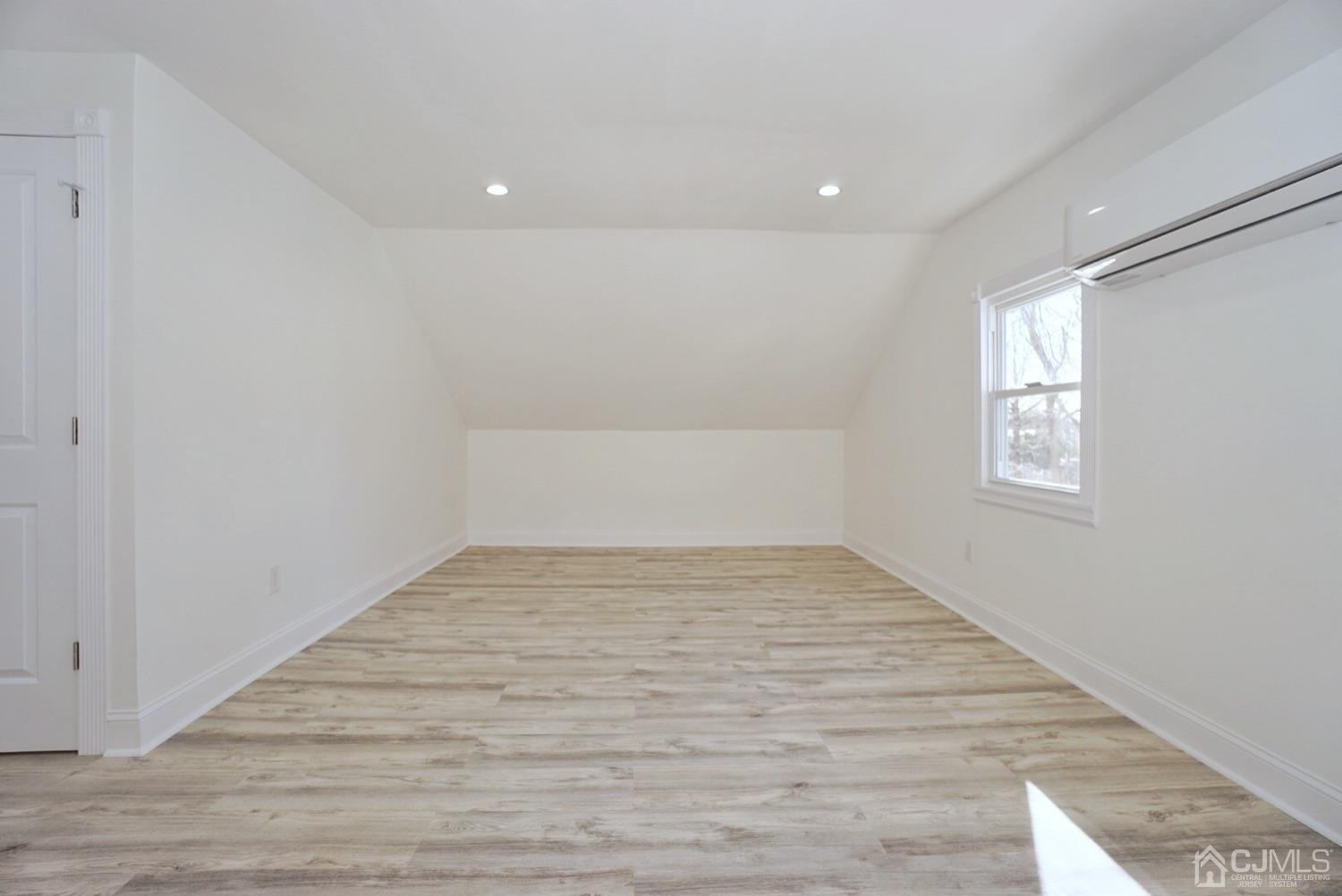 106 Ridge Road Colonia, NJ 07067 - Photo 39 of 44 a view of empty room with wooden floor and fan