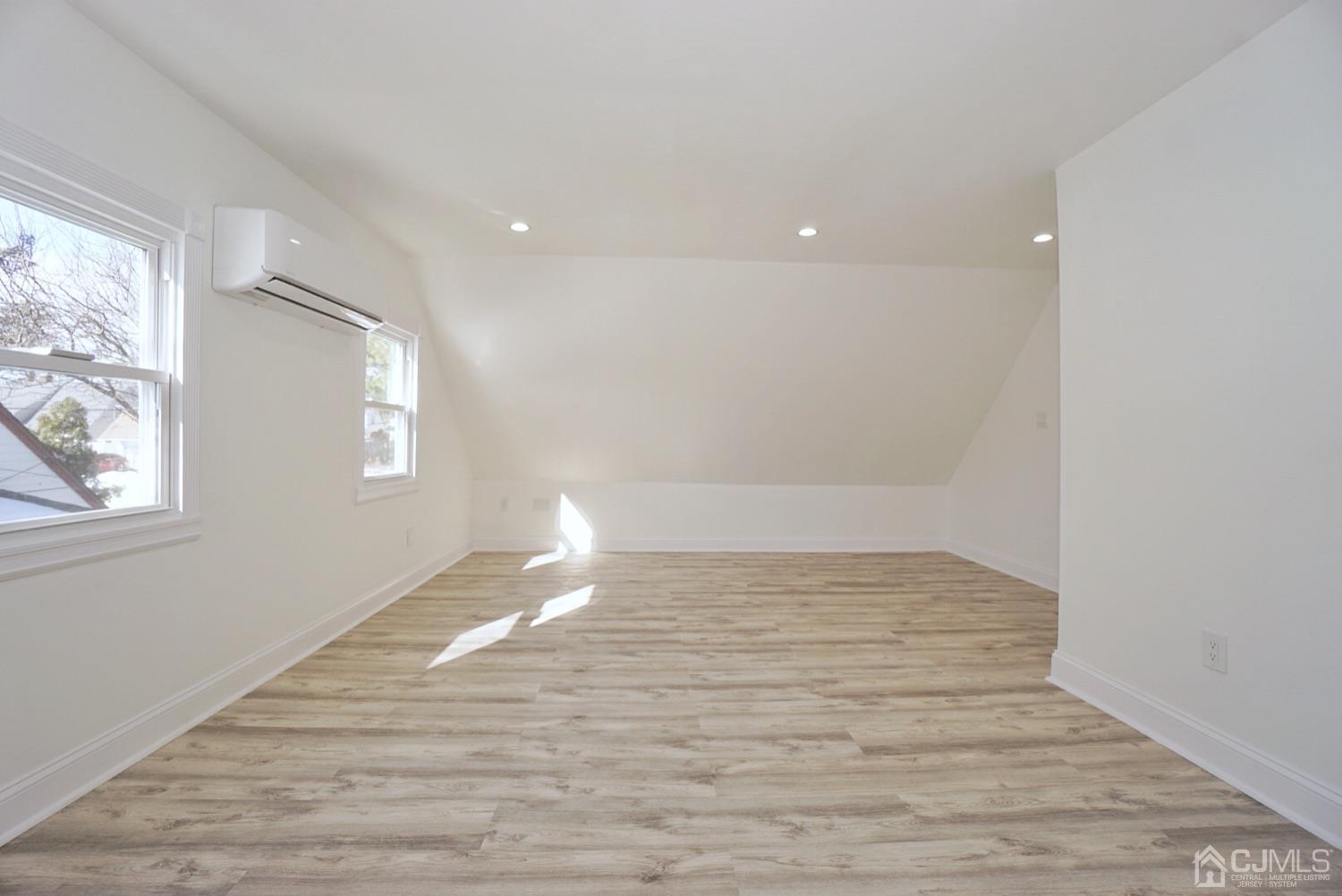 106 Ridge Road Colonia, NJ 07067 - Photo 41 of 44 a view of empty room with wooden floor and fan