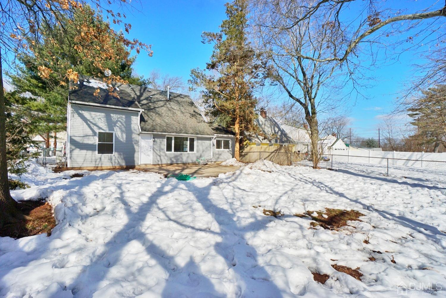 106 Ridge Road Colonia, NJ 07067 - Photo 43 of 44 a view of a white house with a snow on the road