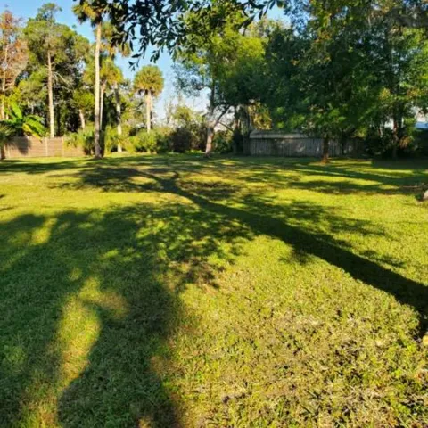 a view of a swimming pool with an outdoor space and seating area