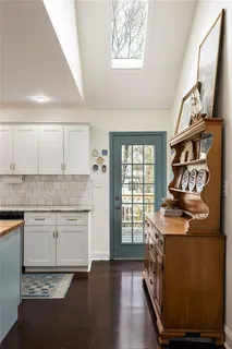 a kitchen with stainless steel appliances granite countertop a stove and a sink