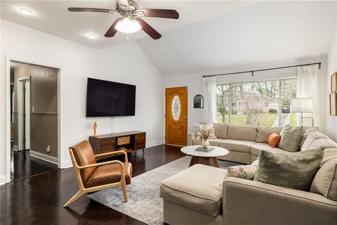 a living room with furniture and a flat screen tv