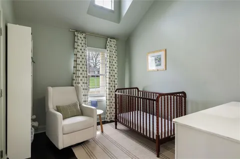 a bedroom with furniture and a window