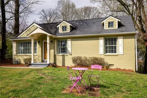a front view of a house with yard