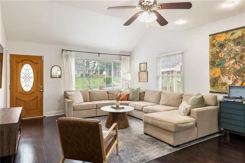 a living room with furniture and a window