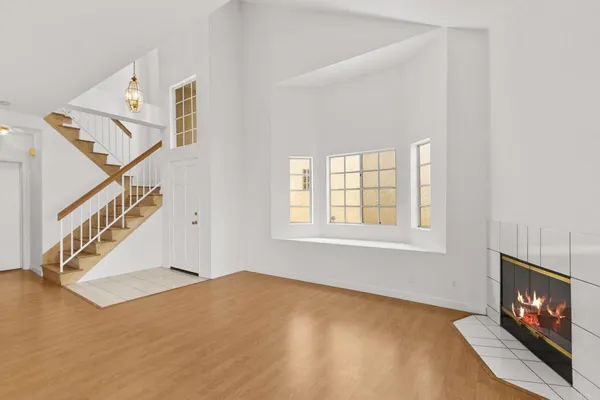 a living room with furniture flat screen tv and a fireplace