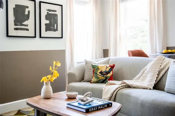 a living room with furniture and window