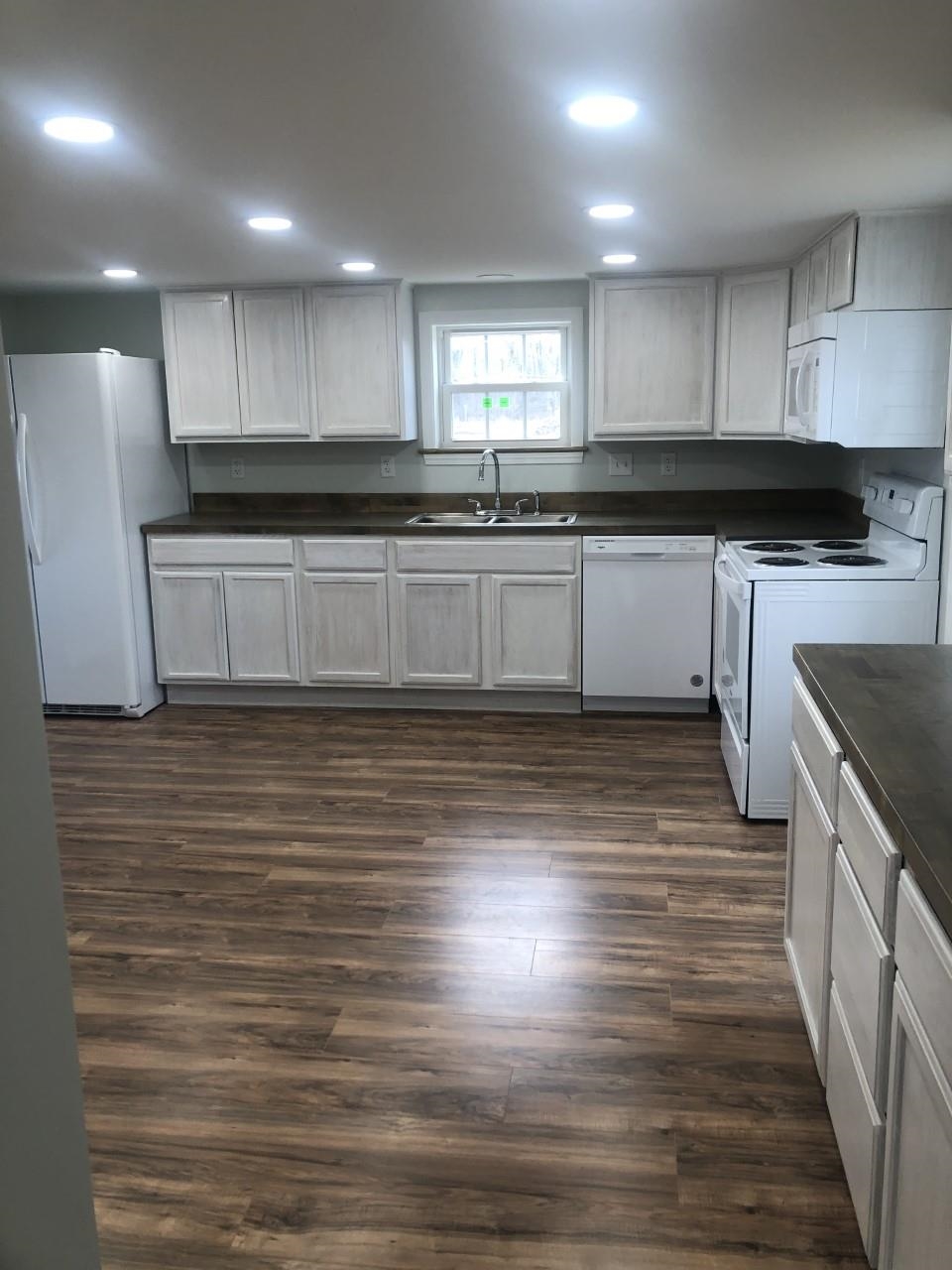 7057 Briery Branch Road Dayton, VA 22821 - Photo 16 of 29 a kitchen with granite countertop a sink and cabinets