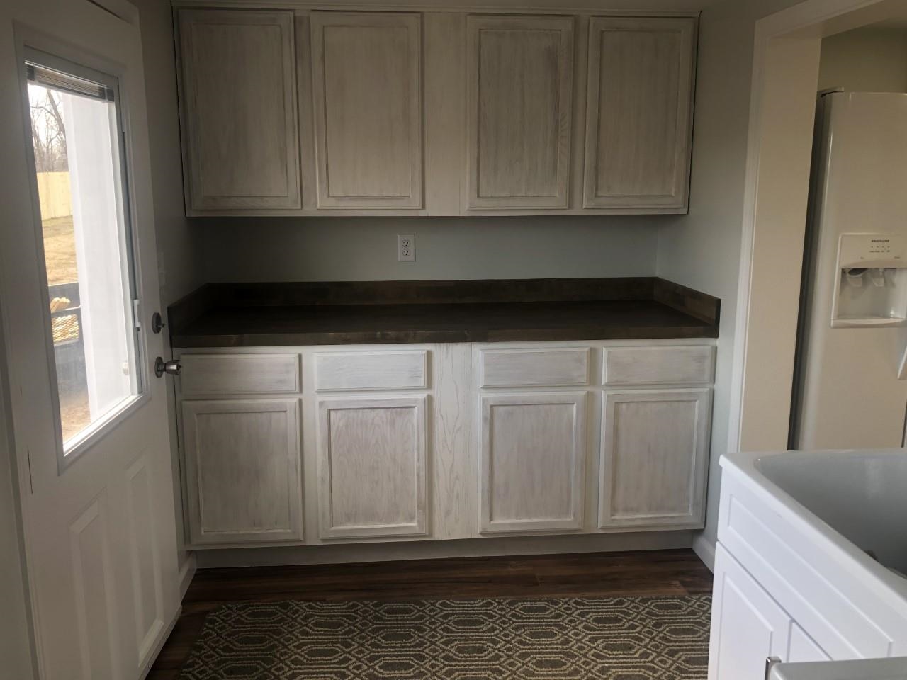 7057 Briery Branch Road Dayton, VA 22821 - Photo 19 of 29 a view of kitchen with granite countertop white cabinets and white appliances