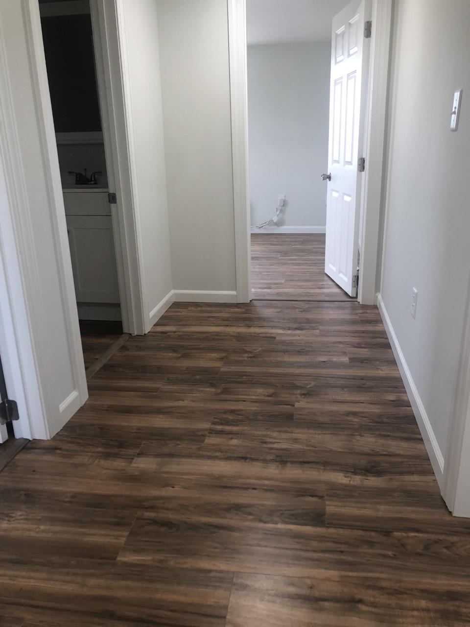 7057 Briery Branch Road Dayton, VA 22821 - Photo 22 of 29 a view of a hallway with wooden floor and staircase