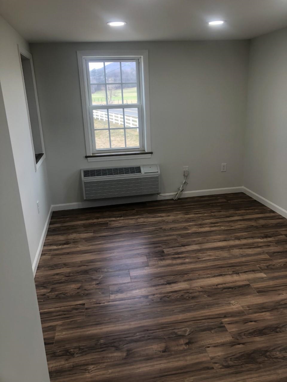 7057 Briery Branch Road Dayton, VA 22821 - Photo 23 of 29 a view of a room with wooden floor and window