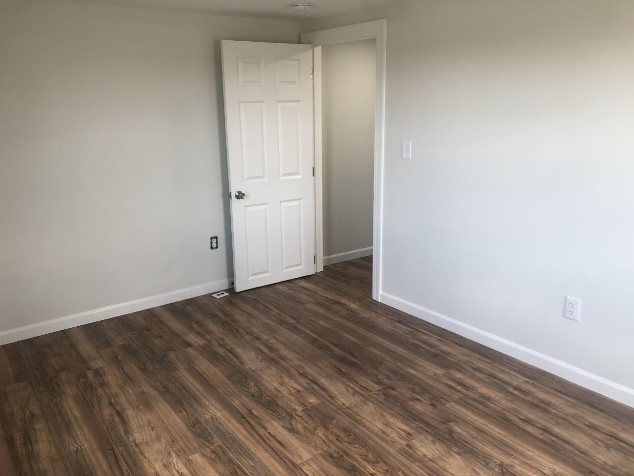 7057 Briery Branch Road Dayton, VA 22821 - Photo 27 of 29 a view of an empty room with wooden floor