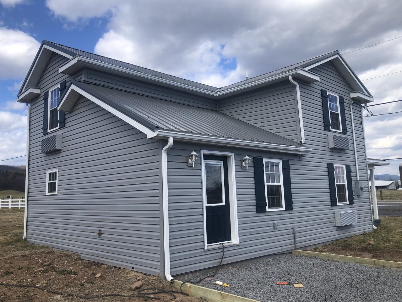 7057 Briery Branch Road Dayton, VA 22821 - Photo 6 of 29 a view of a house with large windows