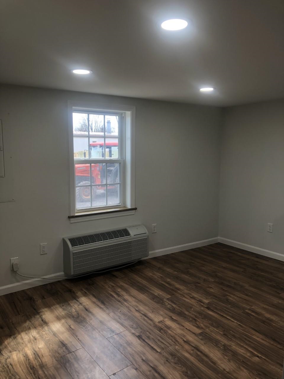 7057 Briery Branch Road Dayton, VA 22821 - Photo 8 of 29 an empty room with wooden floor and windows