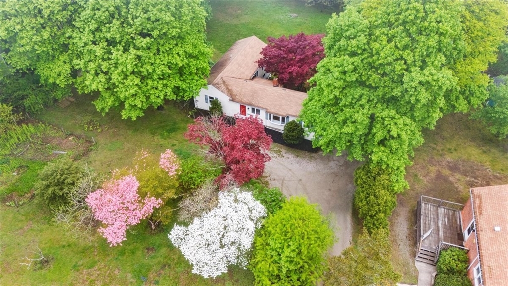 203 High Street, Unit 203 Hingham, MA 02043 - Photo 12 of 42 an aerial view of a house with swimming pool and garden