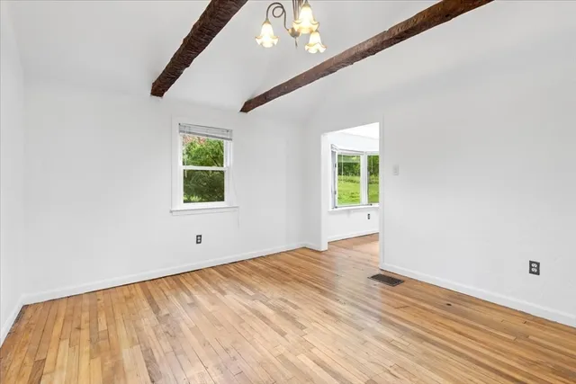 a kitchen with stainless steel appliances granite countertop a stove and white cabinets
