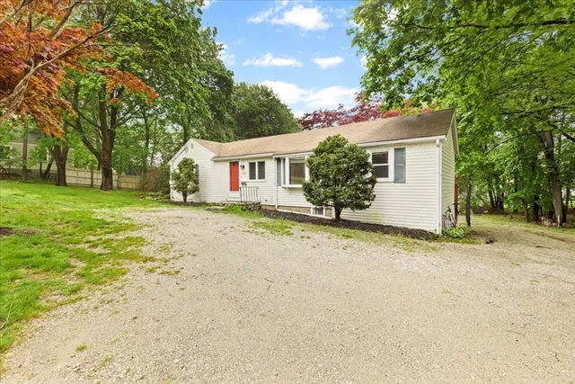 front view of a house with a yard