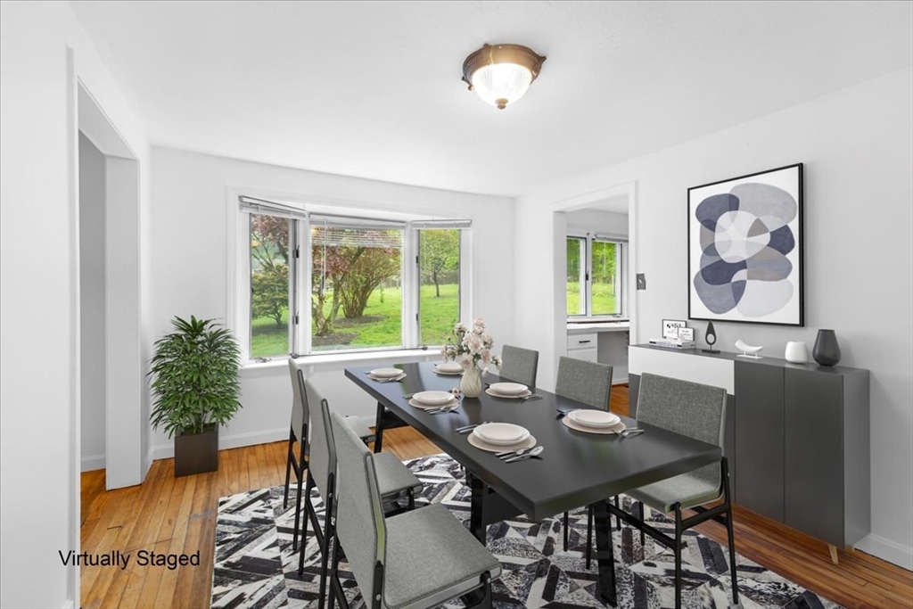203 High Street, Unit 203 Hingham, MA 02043 - Photo 21 of 42 a view of a dining room with furniture window and outside view