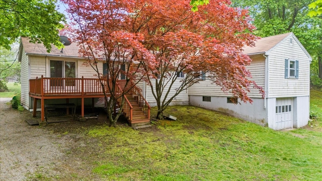203 High Street, Unit 203 Hingham, MA 02043 - Photo 3 of 42 front view of a house with a yard