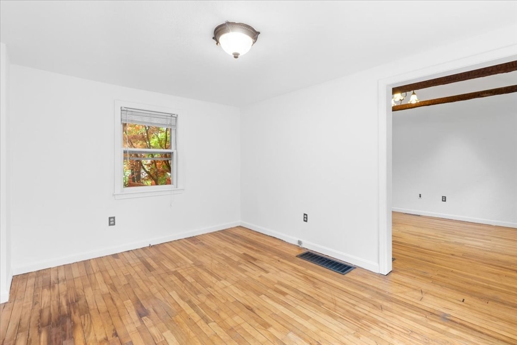 203 High Street, Unit 203 Hingham, MA 02043 - Photo 36 of 42 a view of empty room with wooden floor