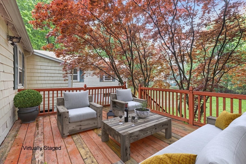 203 High Street, Unit 203 Hingham, MA 02043 - Photo 5 of 42 a view of a patio with couches and wooden floor