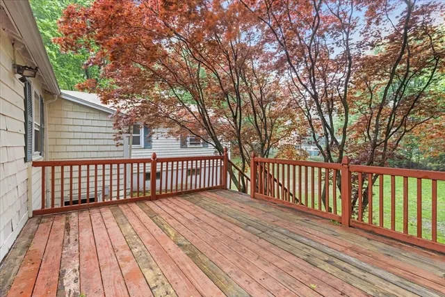 a view of deck with wooden floor and fence
