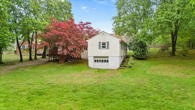 a view of a house with a back yard
