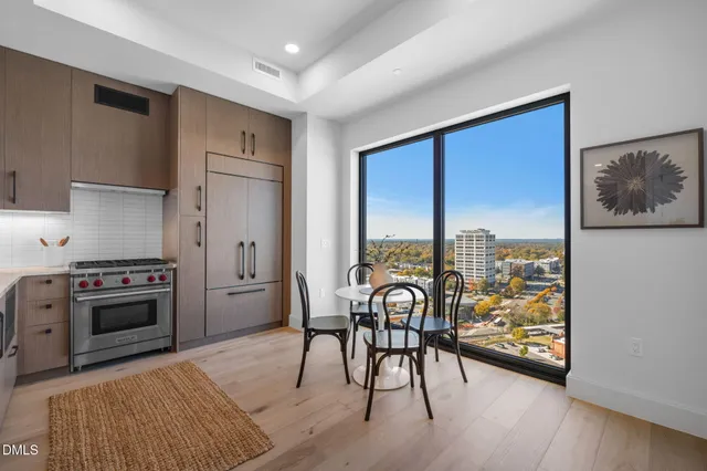 a bedroom with a bed and a table