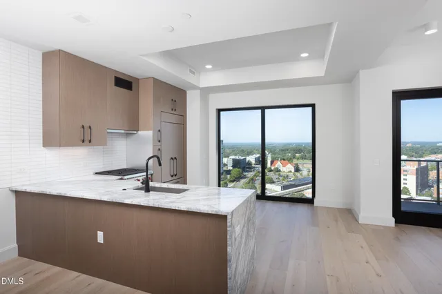 a front view of a house with a yard and fountain