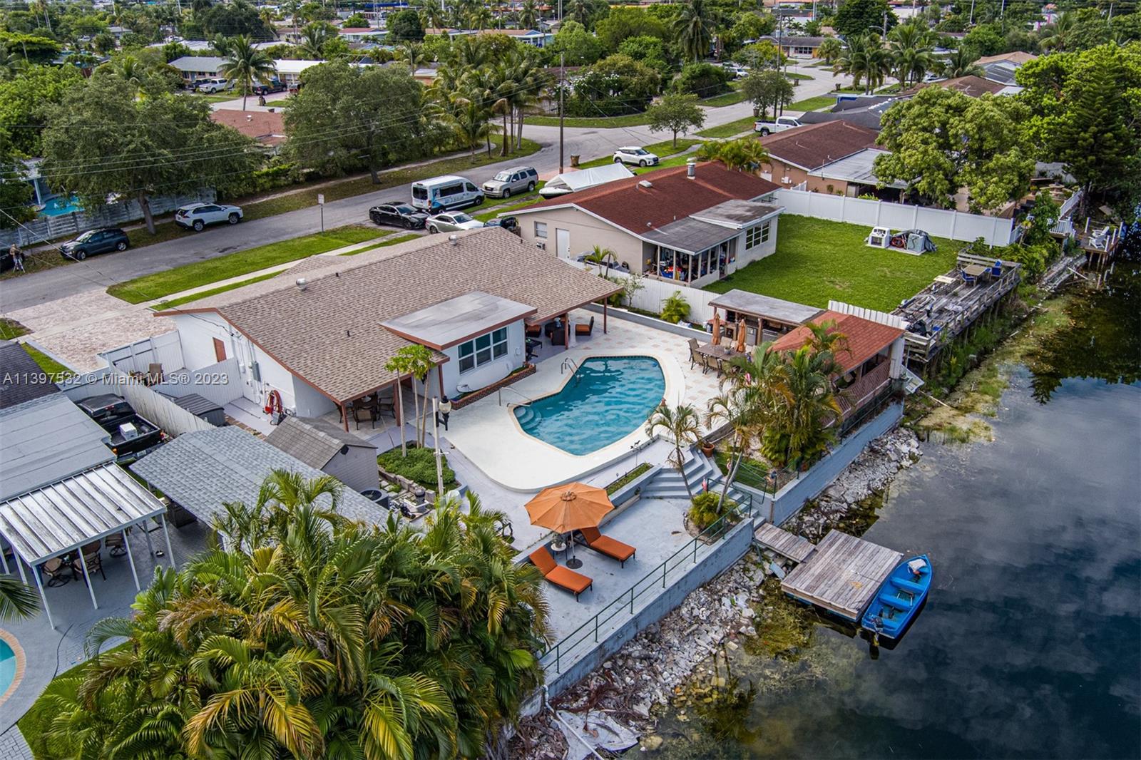 3820 Northwest 7th Avenue Deerfield Beach, FL 33064 - Photo 12 of 37 an aerial view of a pool patio swimming pool and outdoor seating
