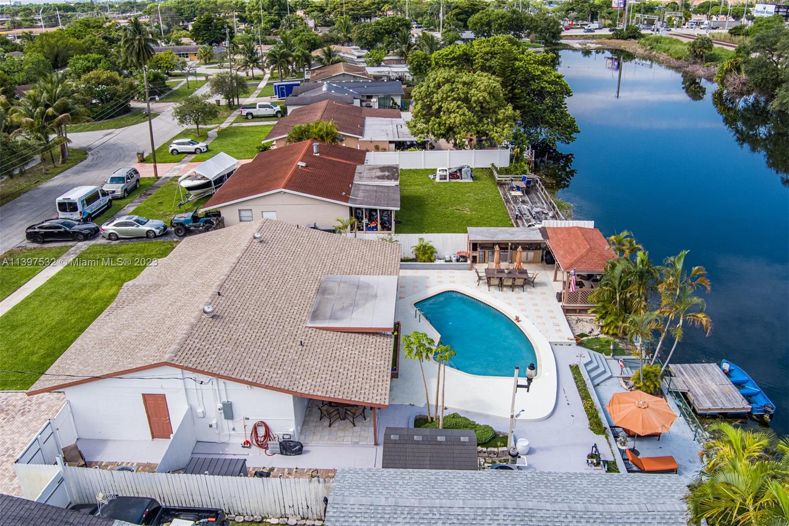 3820 Northwest 7th Avenue Deerfield Beach, FL 33064 - Photo 14 of 37 an aerial view of a house with a yard and lake view