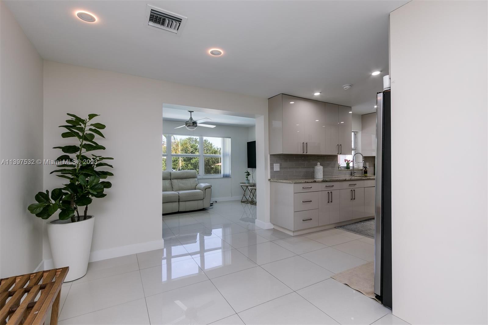 3820 Northwest 7th Avenue Deerfield Beach, FL 33064 - Photo 22 of 37 a view of a kitchen with furniture and a potted plant