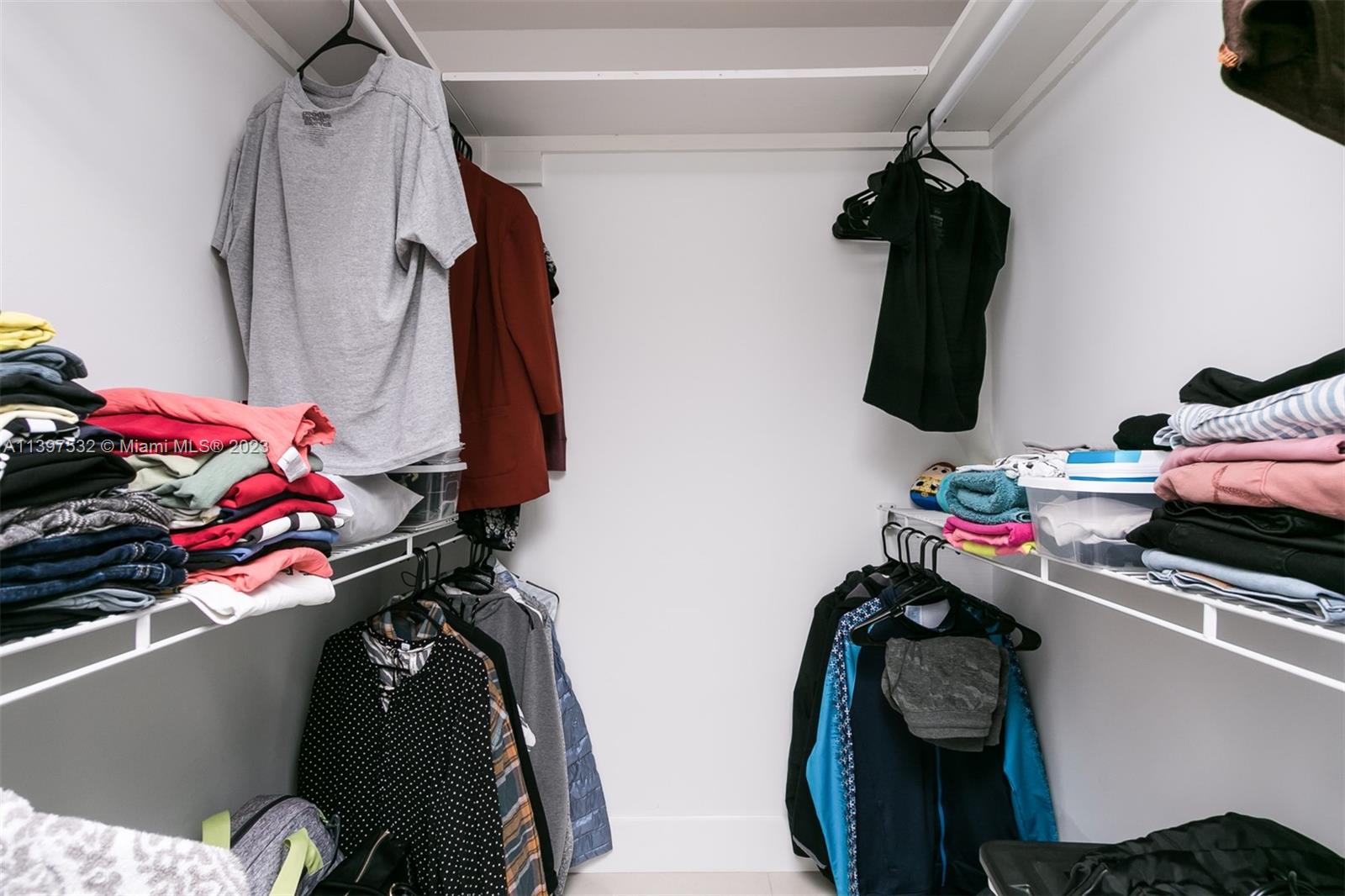 3820 Northwest 7th Avenue Deerfield Beach, FL 33064 - Photo 31 of 37 a view of walk in closet with clothes and shoes