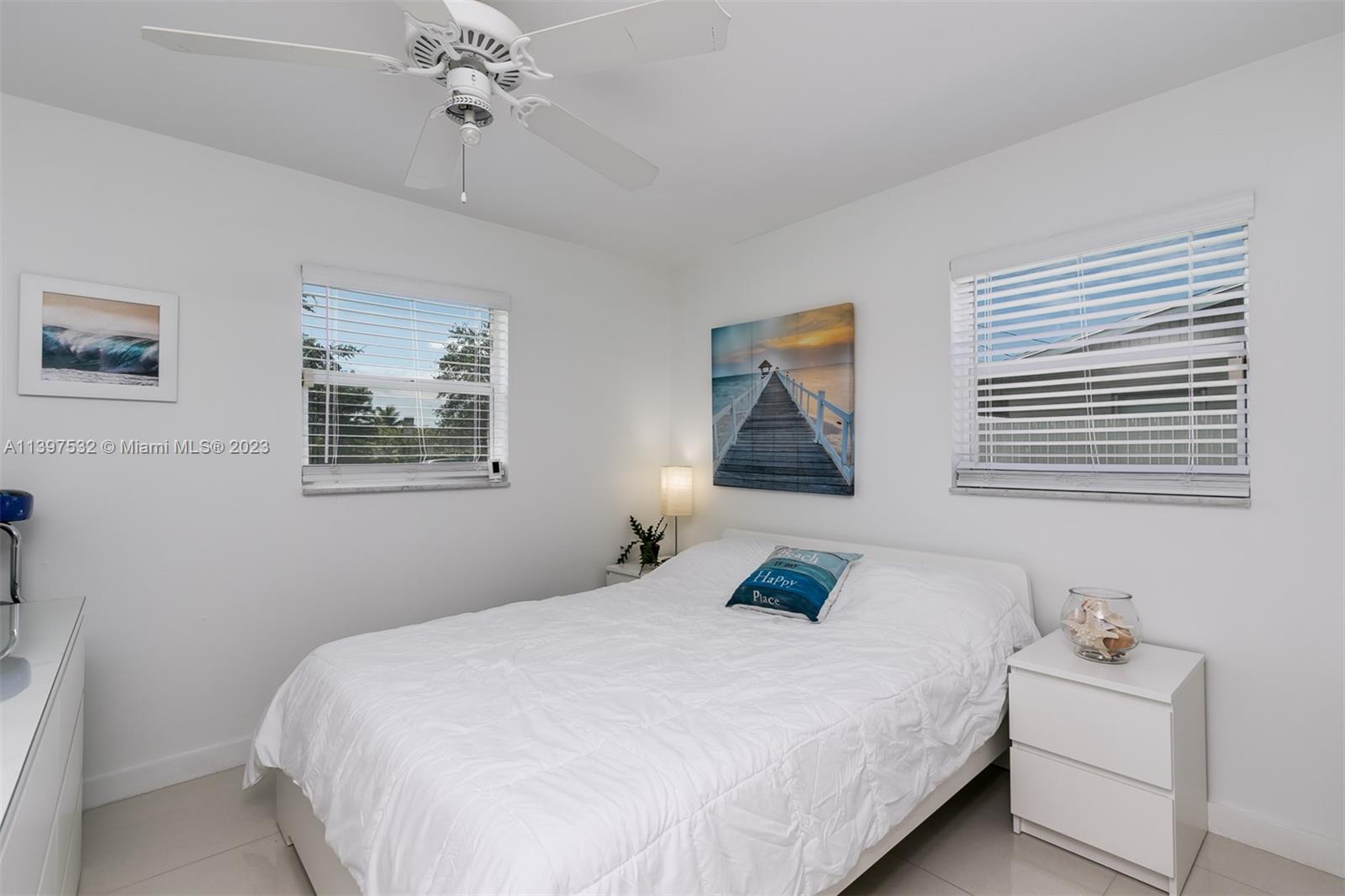 3820 Northwest 7th Avenue Deerfield Beach, FL 33064 - Photo 32 of 37 a bedroom with a bed and a window