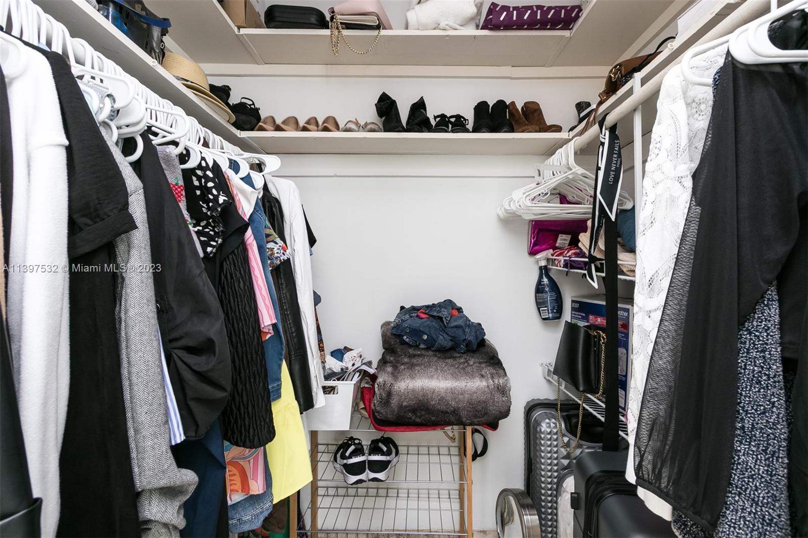 3820 Northwest 7th Avenue Deerfield Beach, FL 33064 - Photo 37 of 37 a view of walk in closet with clothes and shoes
