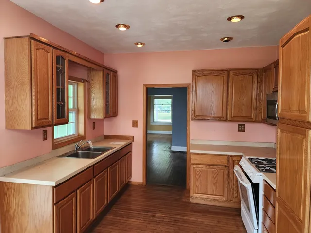 a kitchen that has a sink and a stove